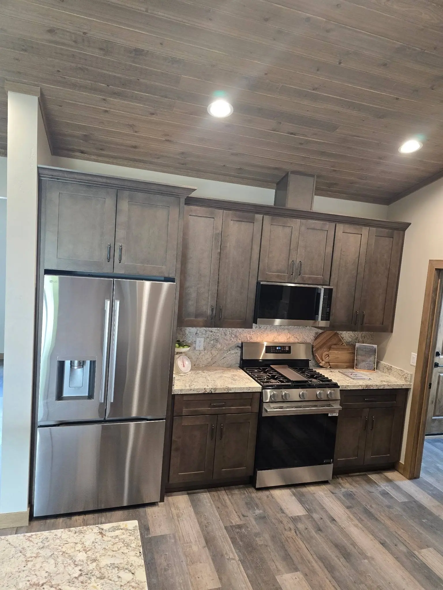 Stained shaker kitchen cabinets installed by DC Cabinets in Show Low, AZ
