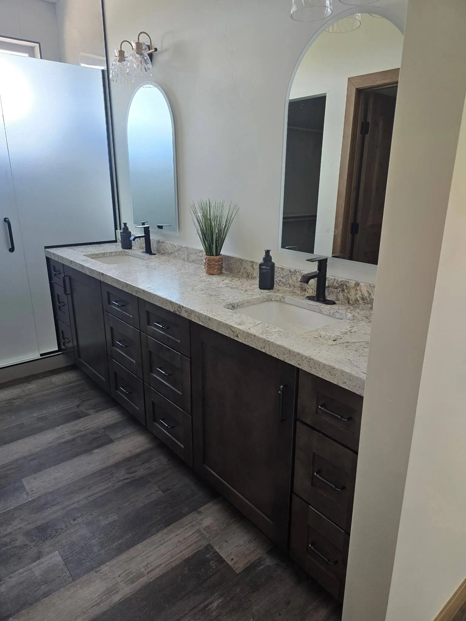 Primary bathroom vanity with shaker doors and drawers by DC Cabinets